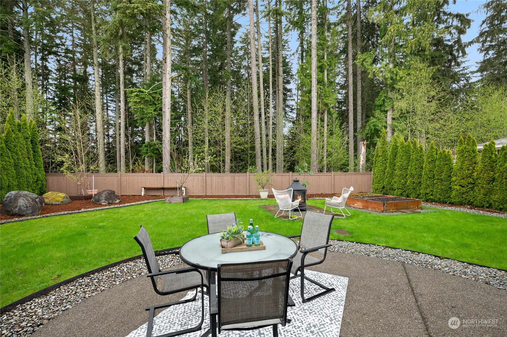10719 Elliston Way Northeast Redmond, WA 98053 - Photo 31 of 39 a view of a chair and table in the garden