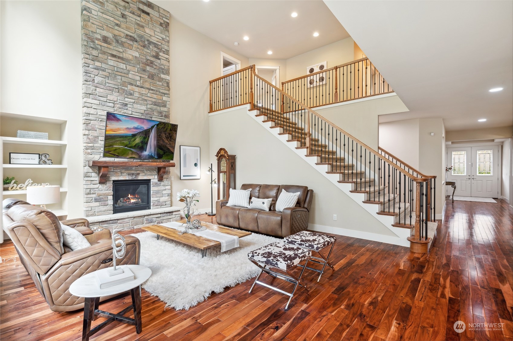 10719 Elliston Way Northeast Redmond, WA 98053 - Photo 7 of 39 a living room with furniture a fireplace and a flat screen tv