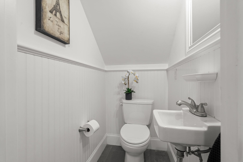 165 Park Avenue, Unit 165 Arlington, MA 02476 - Photo 23 of 32 a bathroom with a toilet sink and mirror