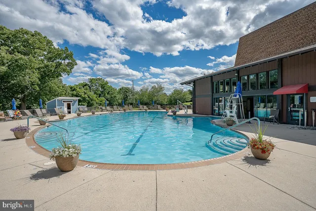 a view of a swimming pool with a patio