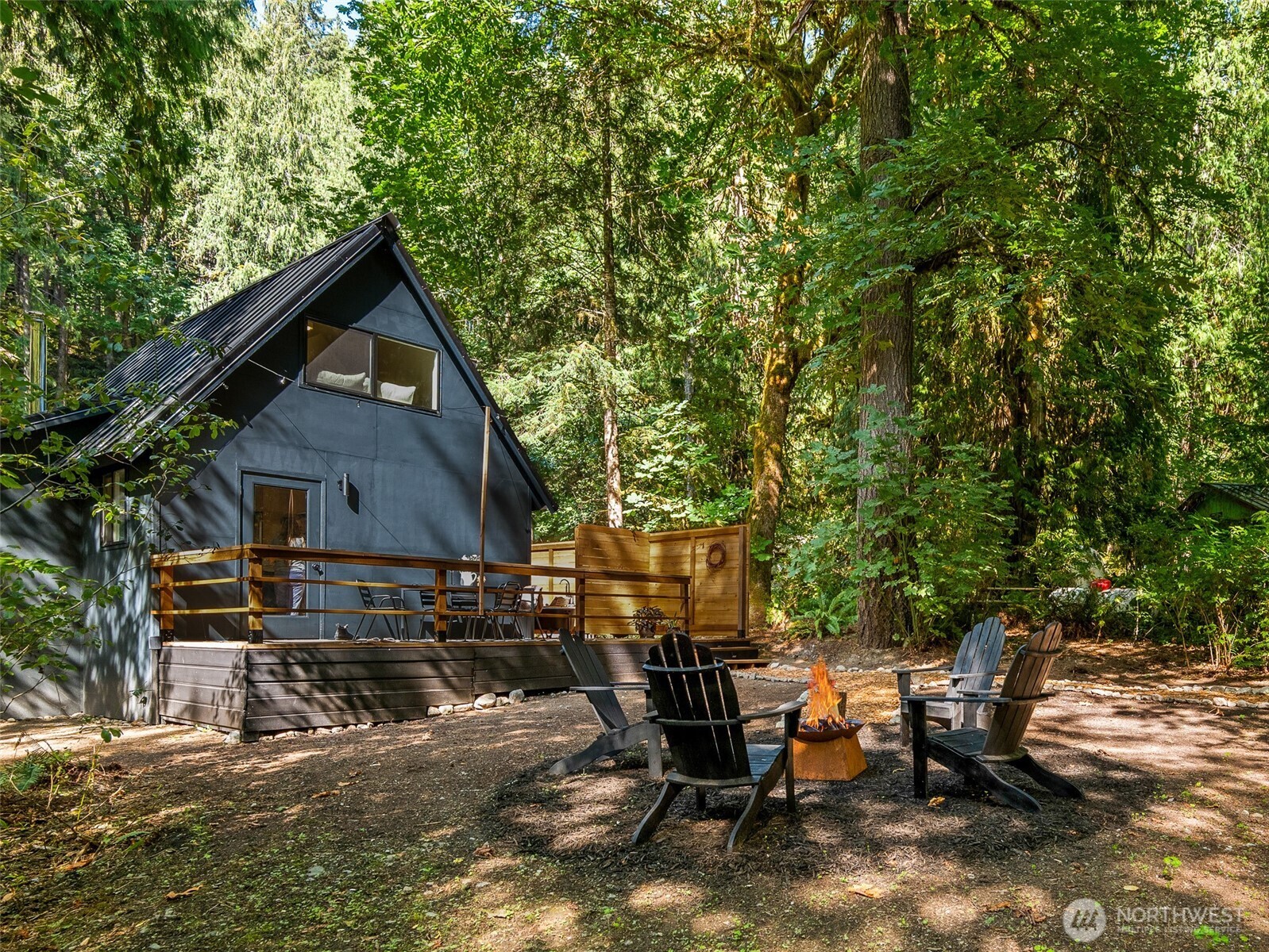 64258 Lookout Mtn Loop Marblemount, WA 98267 - Photo 2 of 40 a backyard of a house with table and chairs