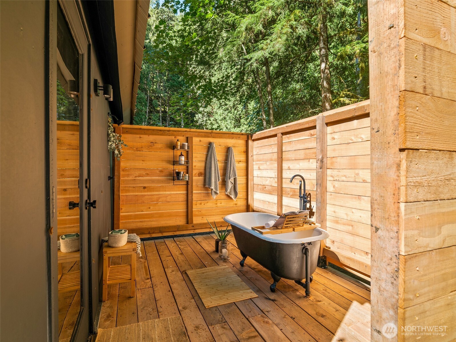 64258 Lookout Mtn Loop Marblemount, WA 98267 - Photo 27 of 40 a view of a balcony with couch and wooden floor