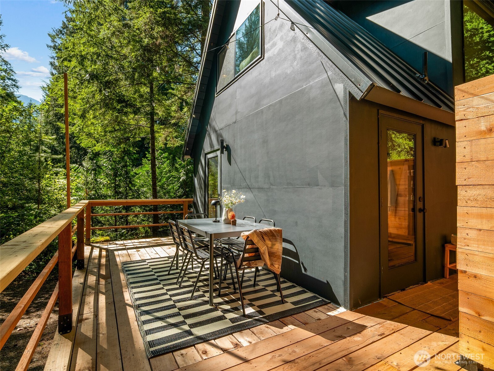 64258 Lookout Mtn Loop Marblemount, WA 98267 - Photo 29 of 40 a view of balcony with wooden floor and outdoor seating