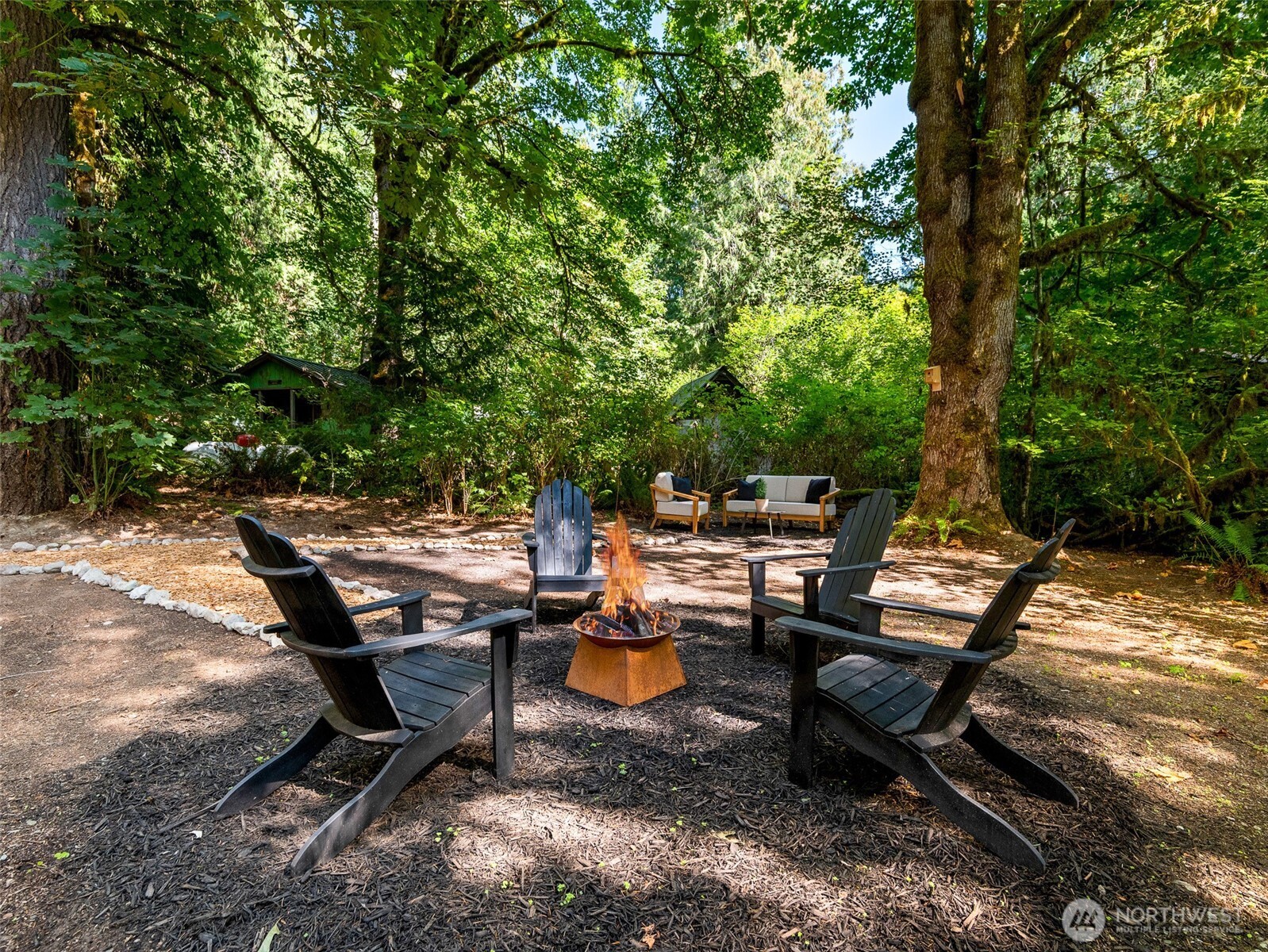 64258 Lookout Mtn Loop Marblemount, WA 98267 - Photo 31 of 40 a backyard of a house with table and chairs