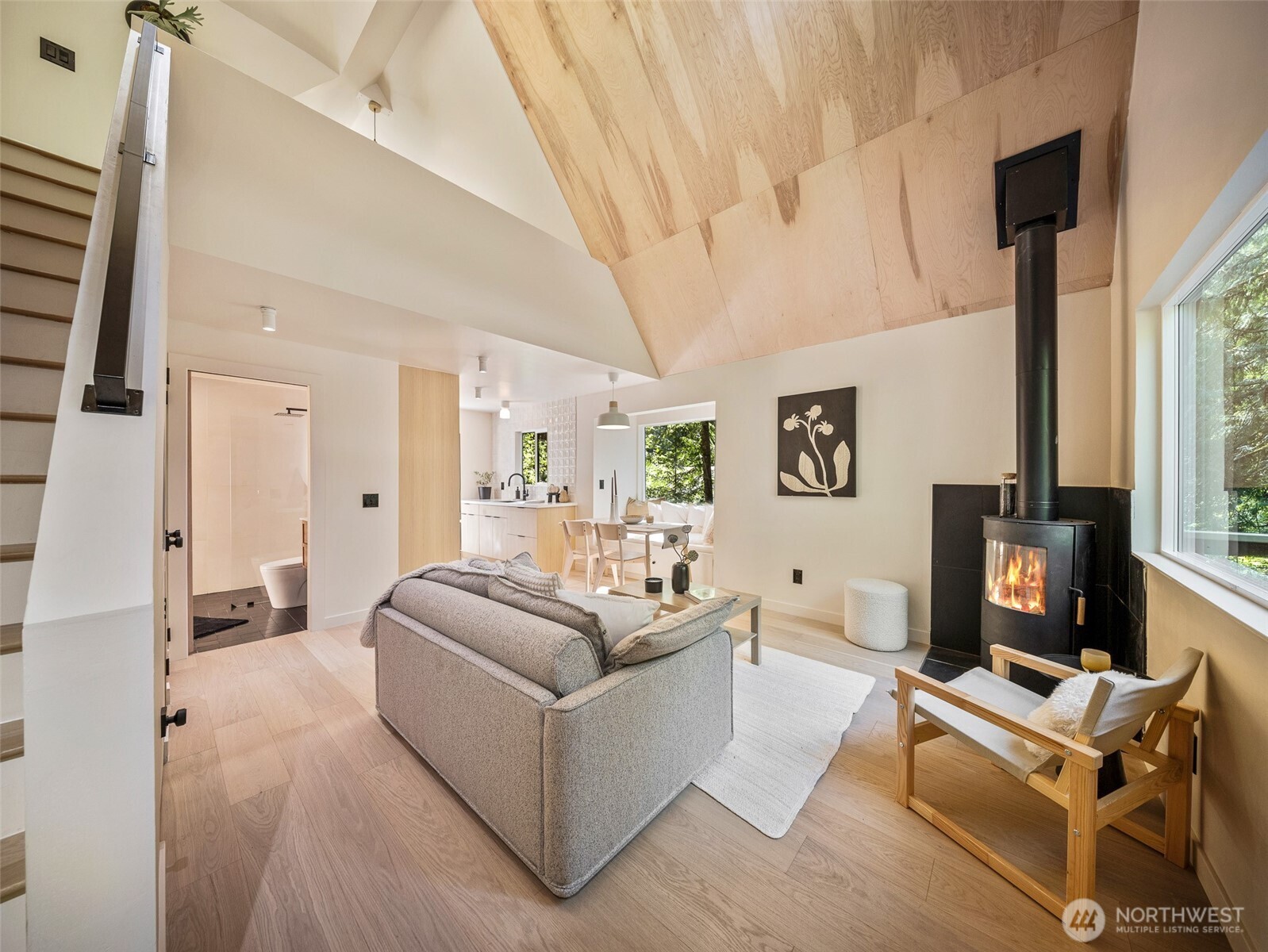 64258 Lookout Mtn Loop Marblemount, WA 98267 - Photo 4 of 40 a living room with furniture a flat screen tv and a fireplace