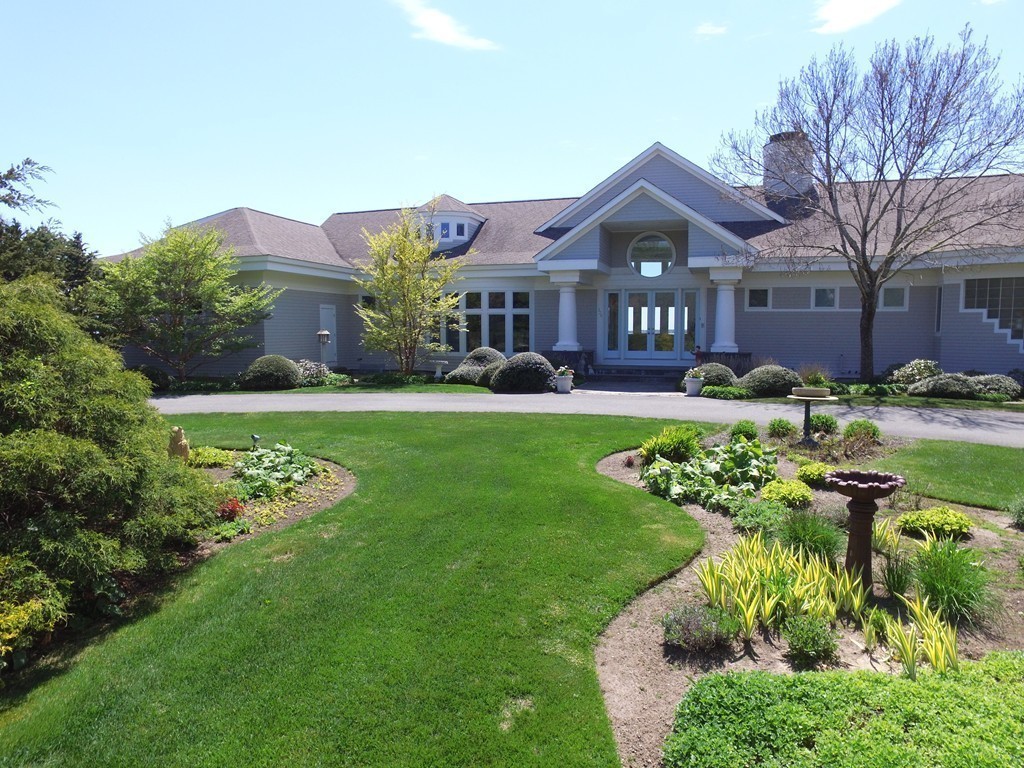 128 Point Road Marion, MA 02738 - Photo 15 of 25 a front view of a house with a garden