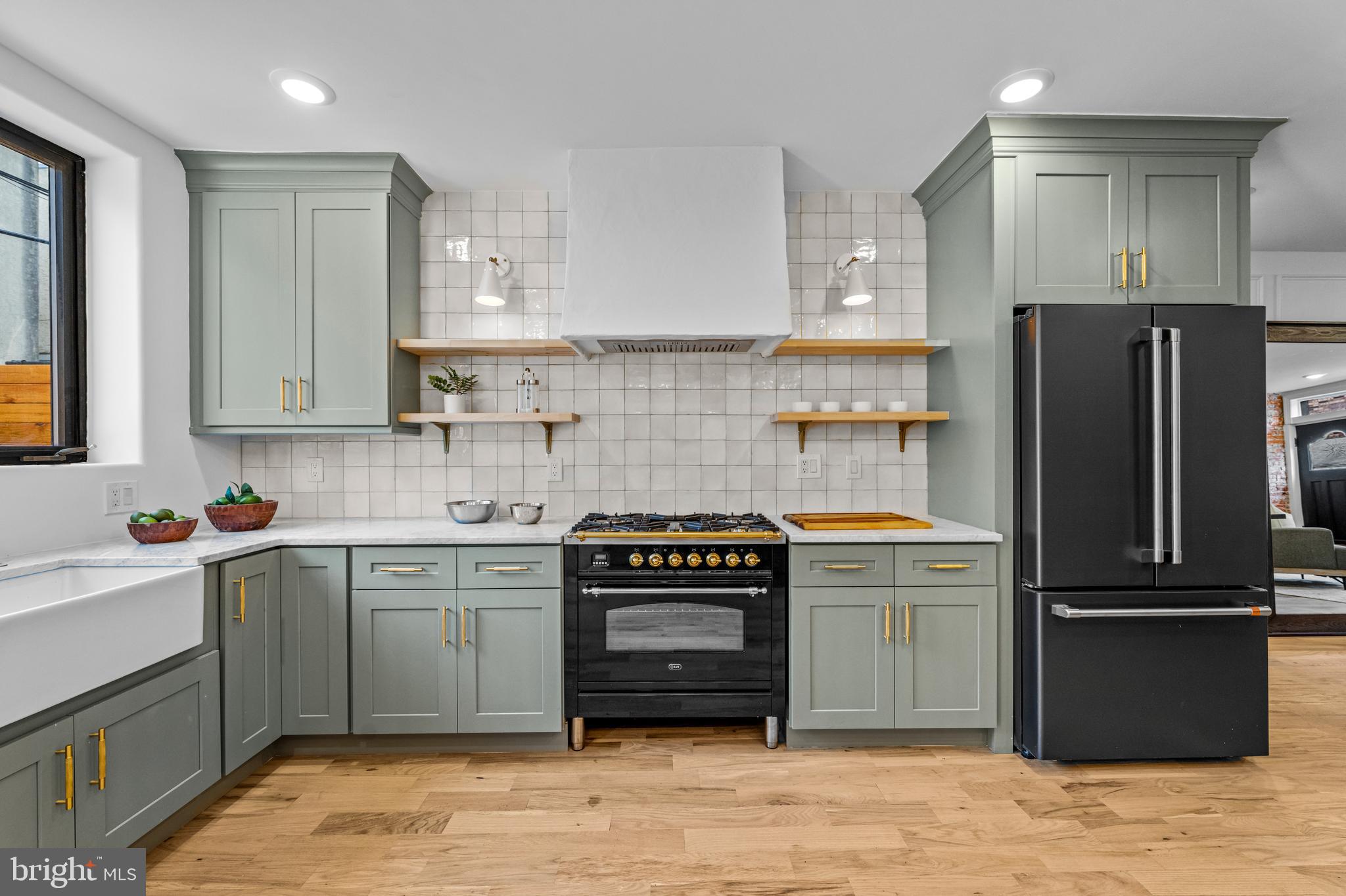 a kitchen with a refrigerator and a sink