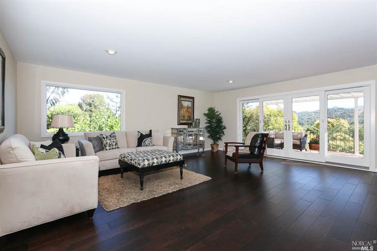 1303 Las Raposas Road San Rafael, CA 94903 - Photo 1 of 1 a living room with furniture and a large window