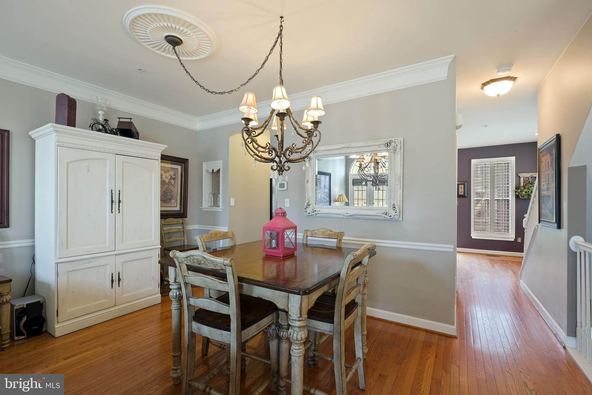 8826 Lew Wallace Road Frederick, MD 21704 - Photo 14 of 33 Hardwood dining room w/ chair & crown molding