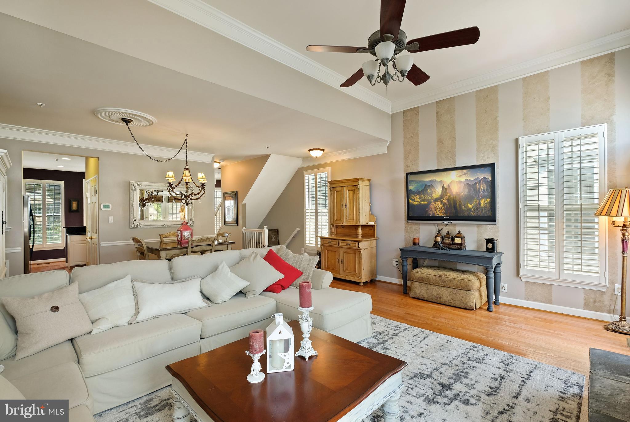 8826 Lew Wallace Road Frederick, MD 21704 - Photo 17 of 33 Living room w/HW floor & plantation shutters