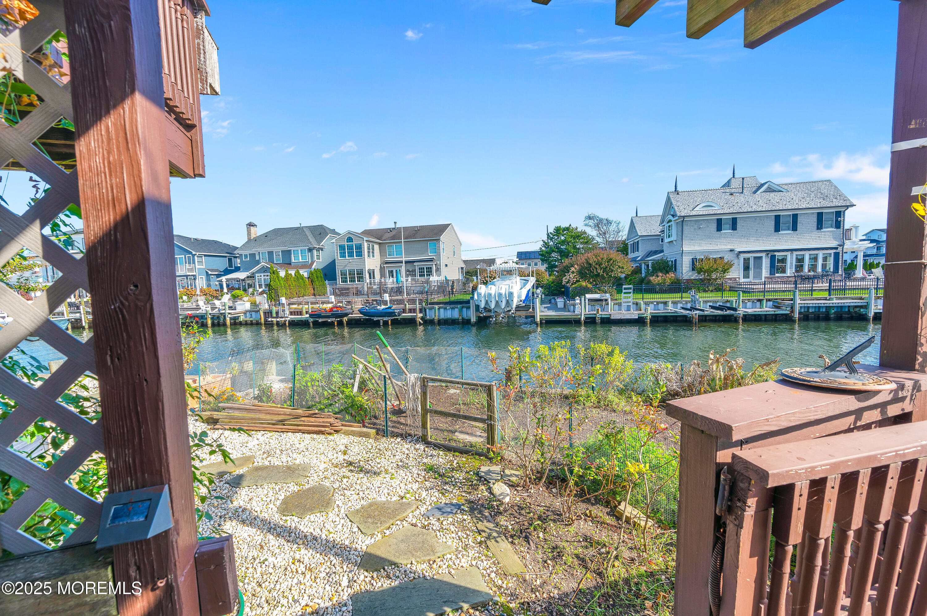 1700 Rue Mirador Point Pleasant, NJ 08742 - Photo 20 of 64 a view of a lake with a building in the background