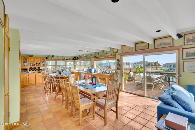 a bedroom with a large bed and a large window