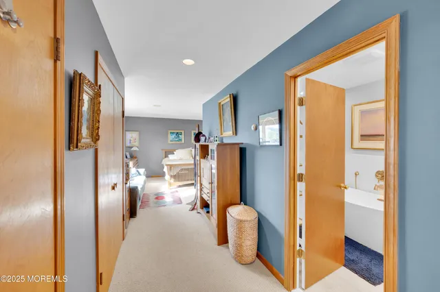 a living room with furniture and stairs