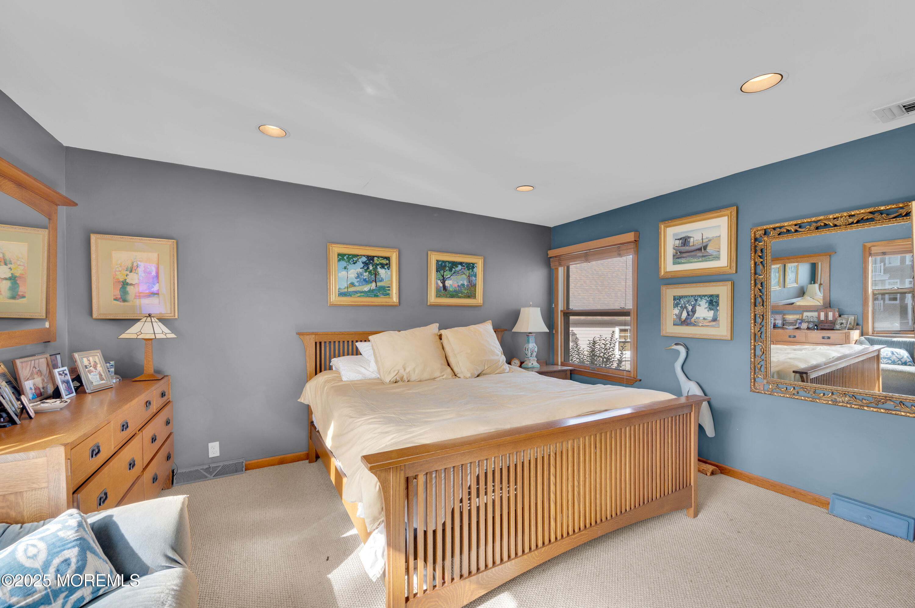 1700 Rue Mirador Point Pleasant, NJ 08742 - Photo 49 of 64 a bed sitting in a bedroom next to a window