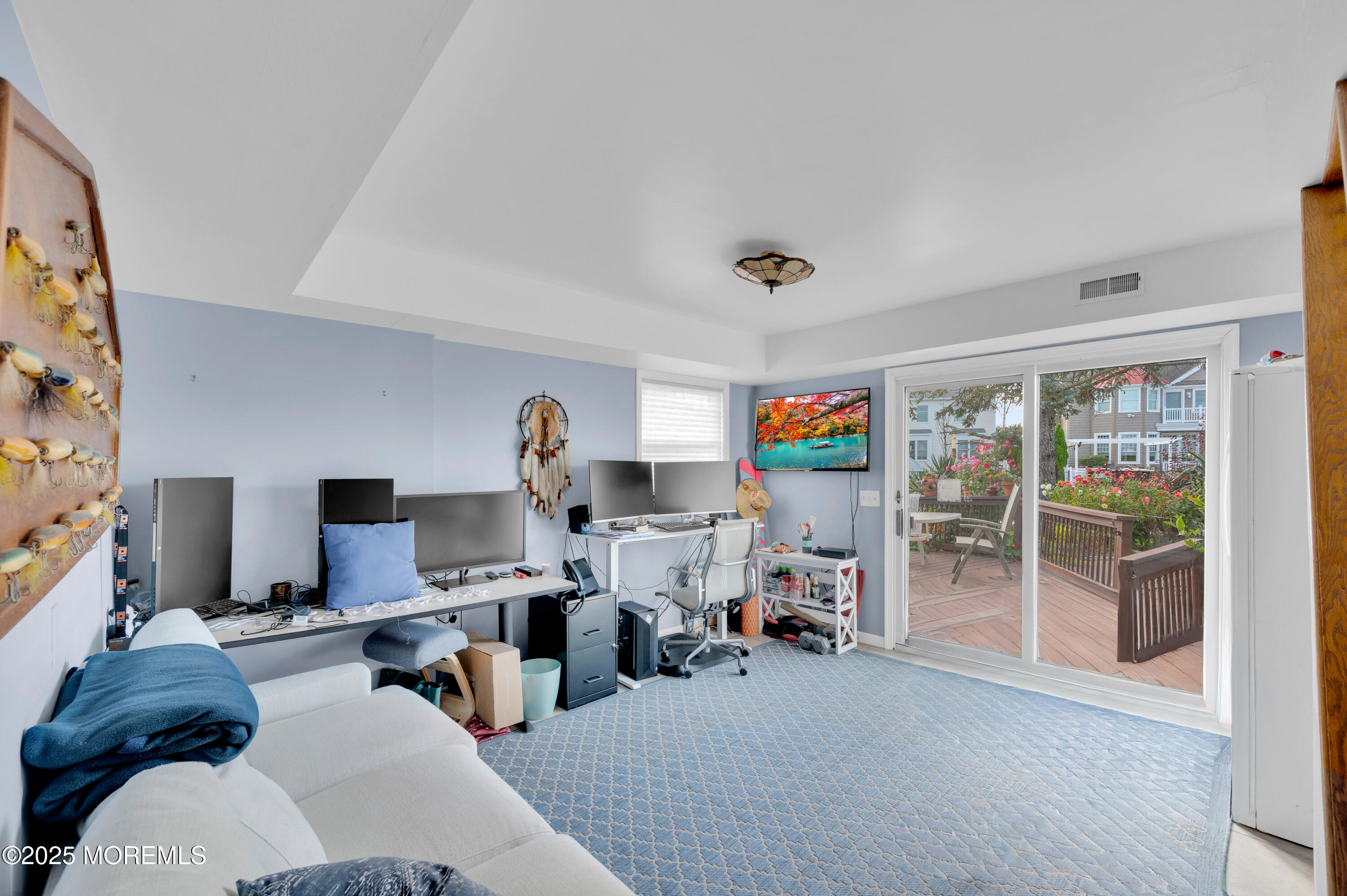 1700 Rue Mirador Point Pleasant, NJ 08742 - Photo 61 of 64 a living room with furniture and a flat screen tv