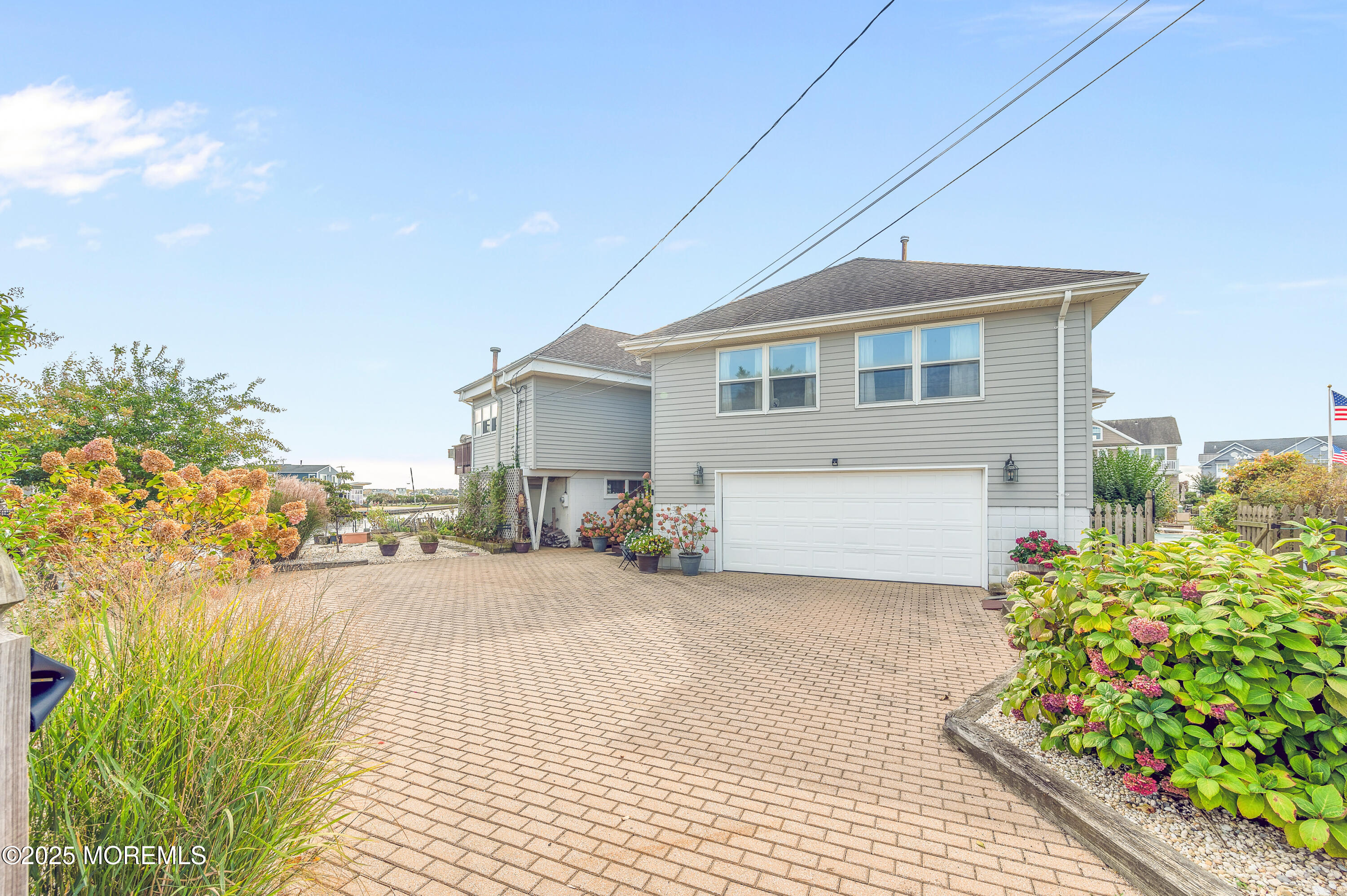 1700 Rue Mirador Point Pleasant, NJ 08742 - Photo 7 of 64 a front view of a house with a yard and potted plants