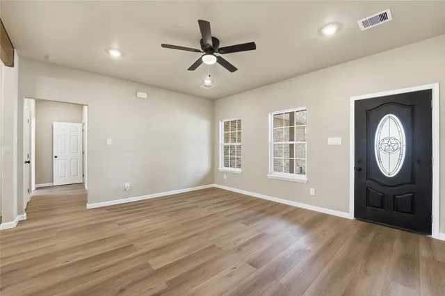 a view of an empty room with a window