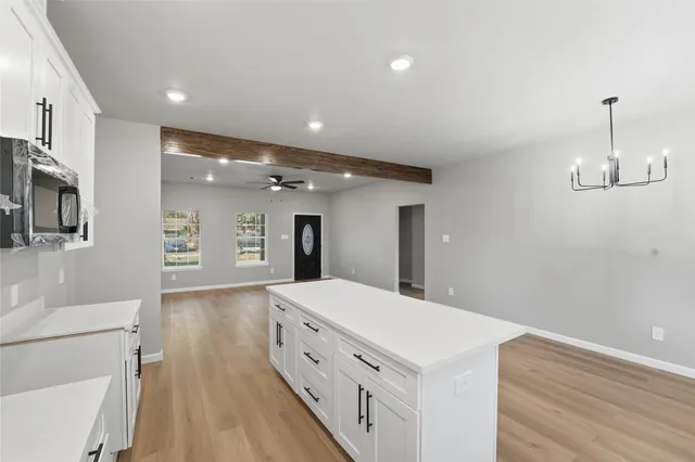 a spacious bathroom with a double vanity sink and a mirror