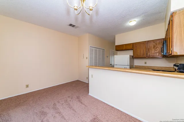 a kitchen with stainless steel appliances cabinets a sink and a counter top space