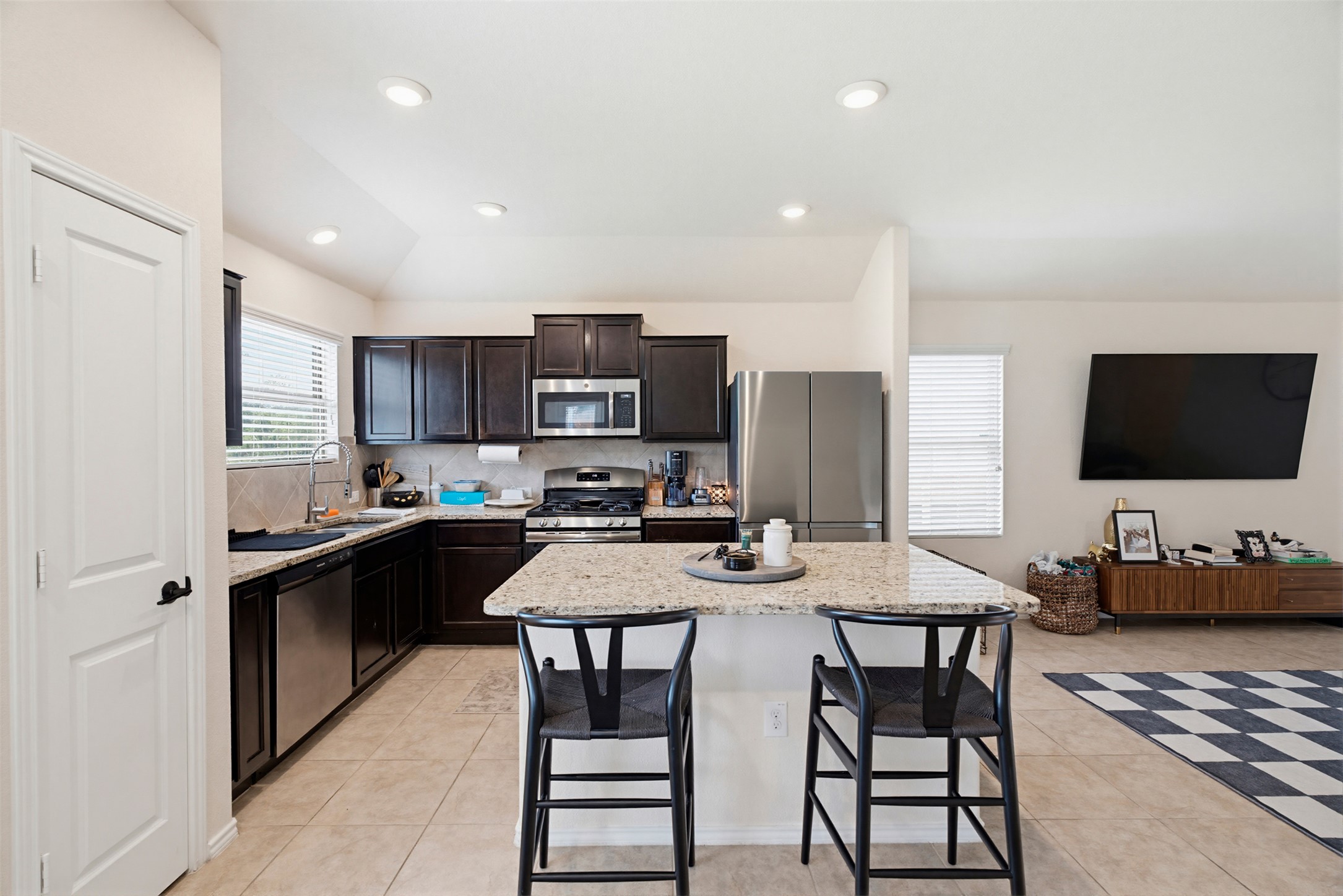 5705 Southerner Way Austin, TX 78747 - Photo 4 of 22 A well-appointed kitchen offers ample counter space and convenient island seating.