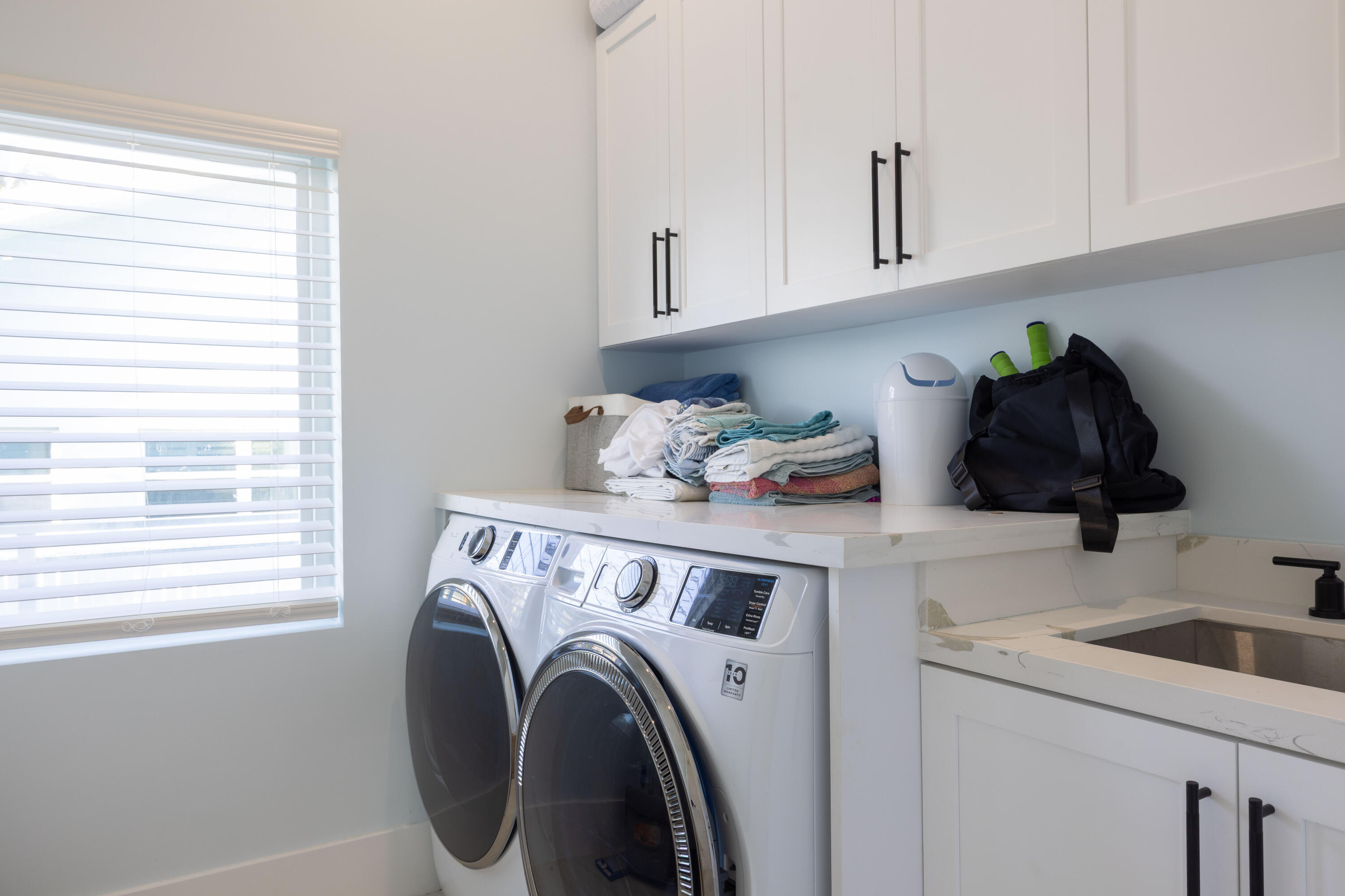 241 12th Street Key Colony Beach, FL 33051 - Photo 13 of 74 a view of washer and dryer with kitchen countertops