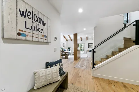 a living room with furniture and stairs