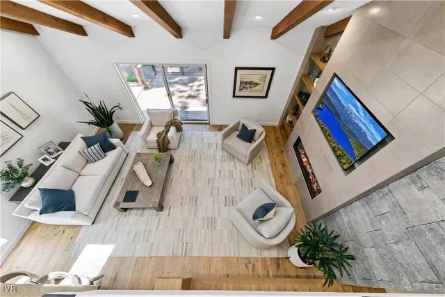a view of living room with furniture and wooden floor