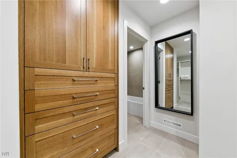 a view of dresser and mirror