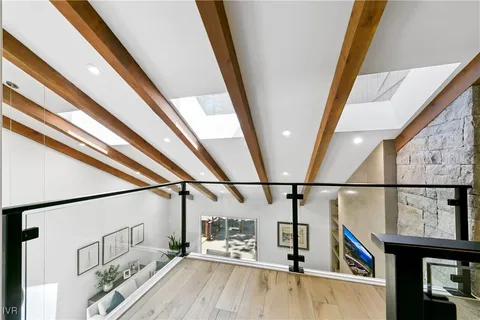 a view of hallway with seating area and furniture