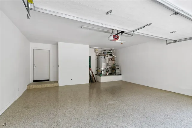 an empty room with closet and a ceiling fan