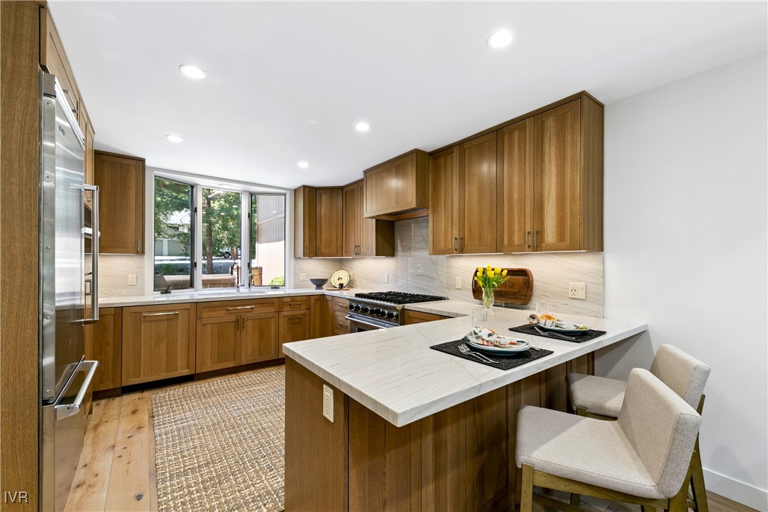 150 Juanita Drive, Unit 2 Incline Village, NV 89451 - Photo 7 of 41 a kitchen with a stove a sink cabinets and wooden floor