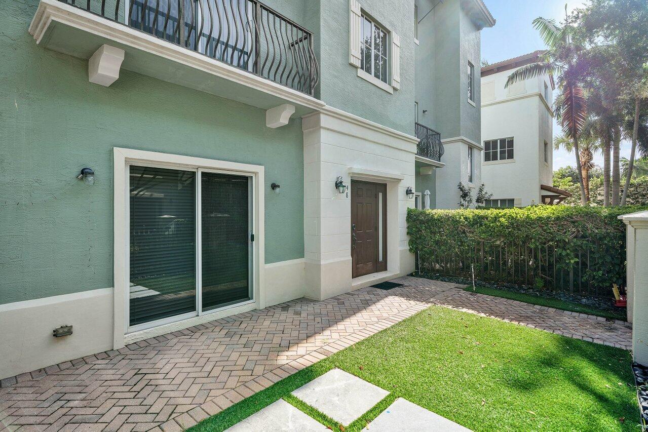 48 Northwest Hawthorne Place Boca Raton, FL 33432 - Photo 4 of 35 Private Patio and Sliding Glass Doors
