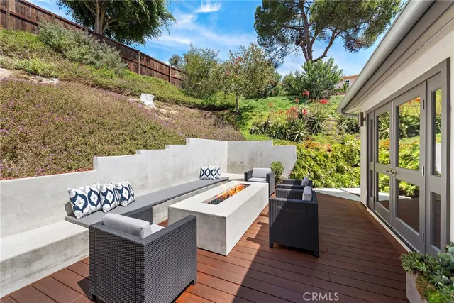 a view of a backyard with potted plants