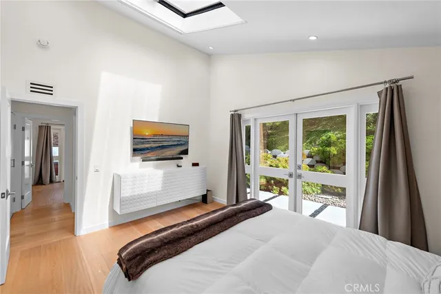 a bathroom with a double vanity sink mirror and shower