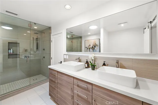 a white bath tub sitting next to a white sink
