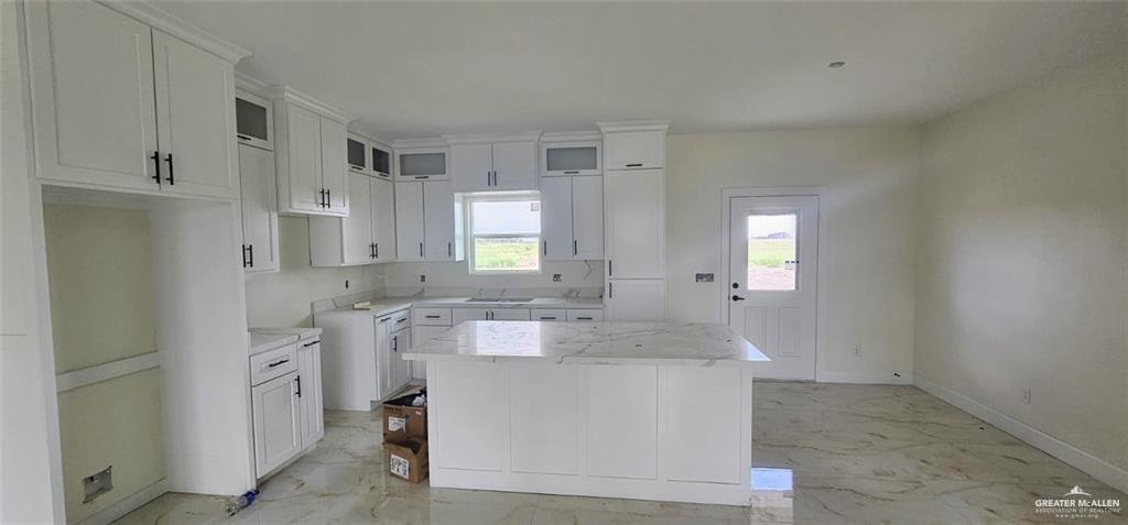 121 Lenon Street Edcouch, TX 78538 - Photo 5 of 8 a bathroom with a granite countertop sink and a mirror
