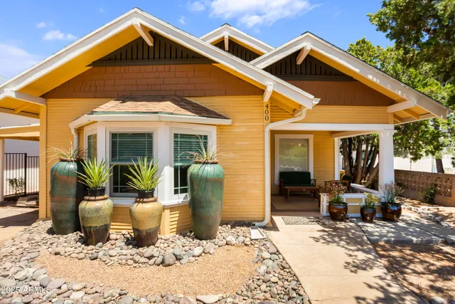 a view of empty room with wooden floor and fireplace