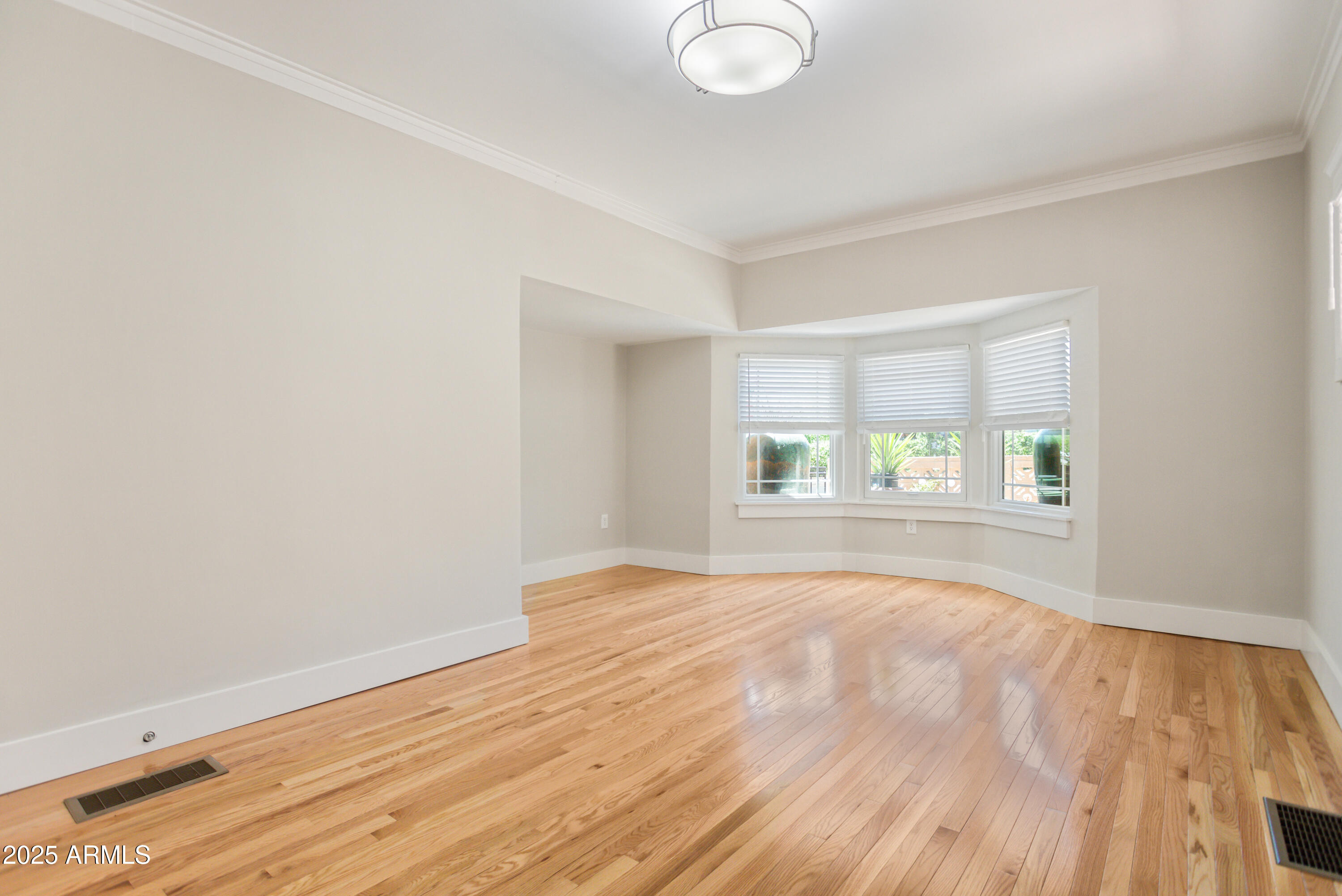 400 Powell Street Bisbee, AZ 85603 - Photo 28 of 57 a view of empty room with wooden floor and fan
