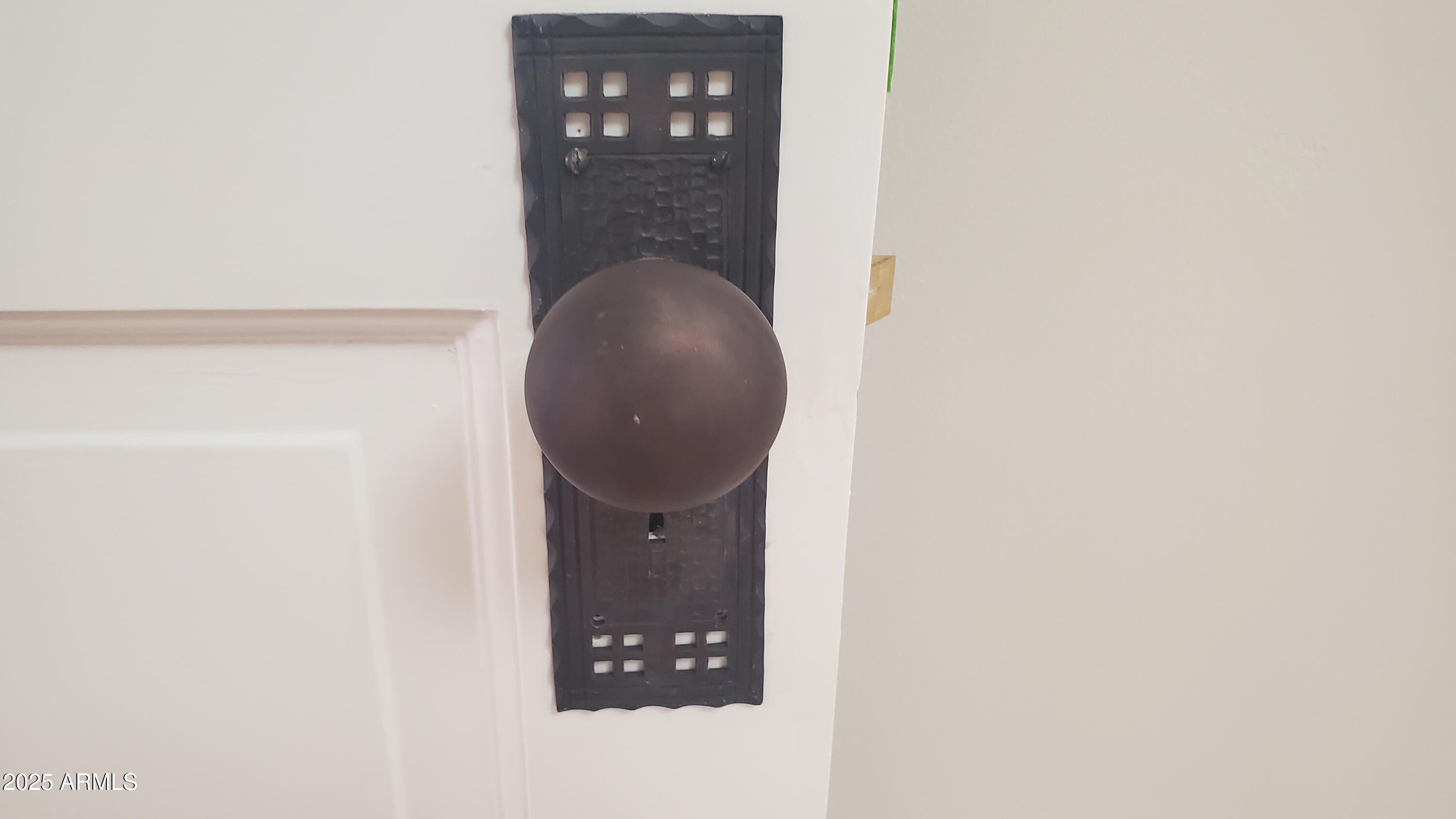 400 Powell Street Bisbee, AZ 85603 - Photo 33 of 57 a close view of door lock