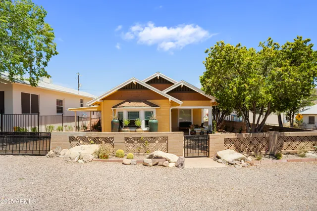 a view of a room with wooden floor and window