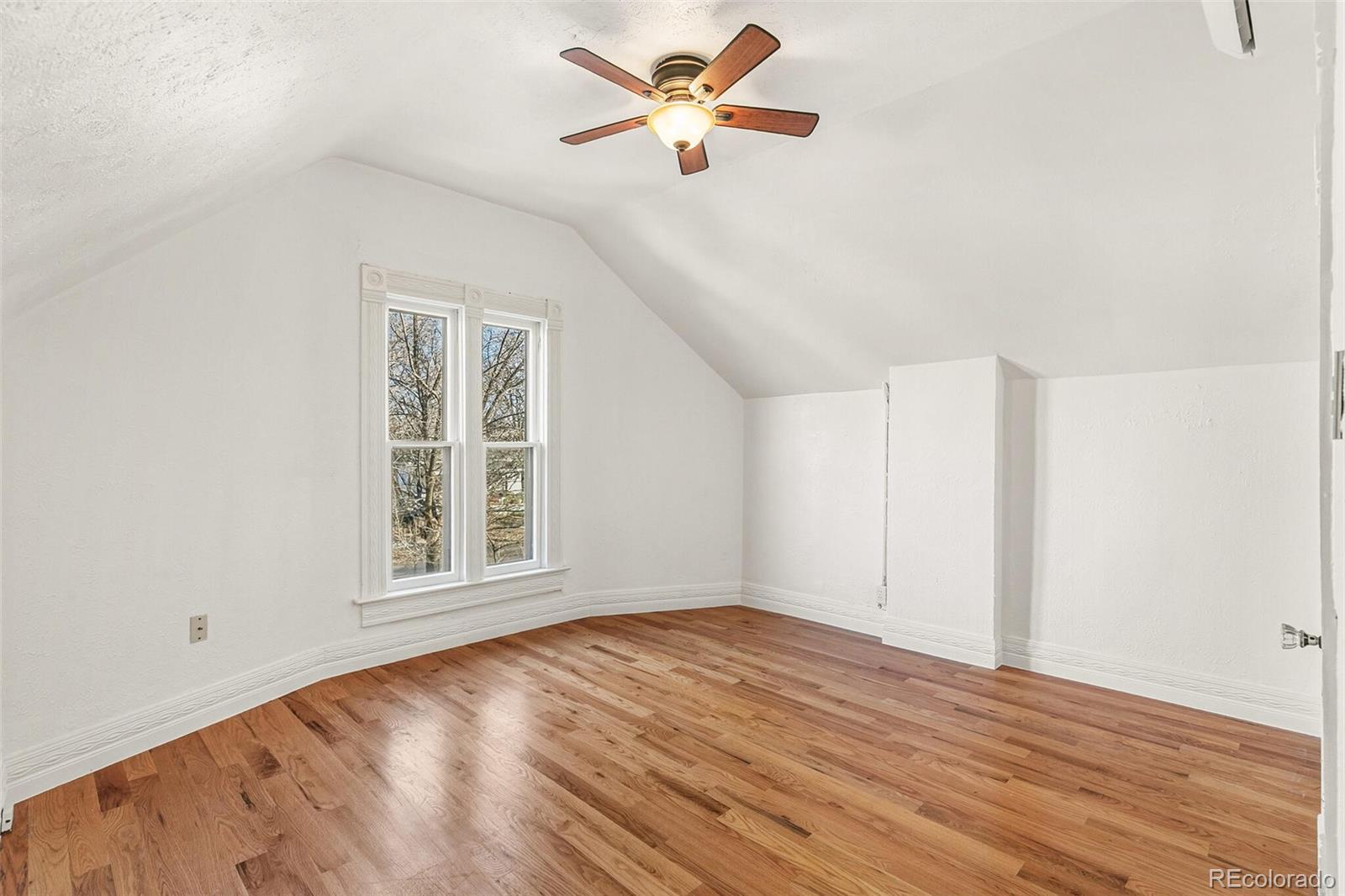 3885 Wolff Street Denver, CO 80212 - Photo 30 of 50 wooden floor in an empty room with a window