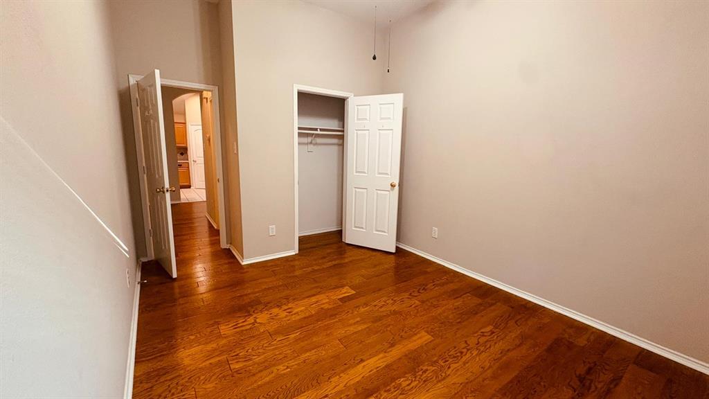 5970 Dustin Trail Frisco, TX 75034 - Photo 25 of 31 Room featuring rich wood-finish flooring and neutral wall tones