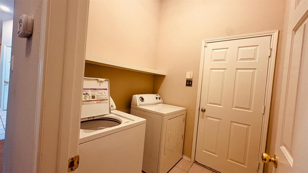 5970 Dustin Trail Frisco, TX 75034 - Photo 26 of 31 Dedicated laundry area featuring tile flooring, a built-in shelf, and a light-colored wall palette