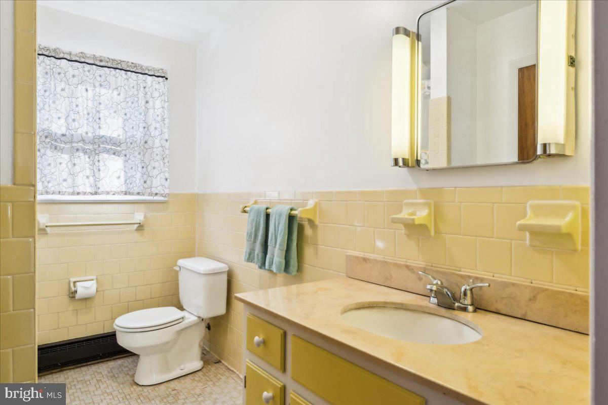 4801 Avery Road Shady Side, MD 20764 - Photo 23 of 25 a bathroom with a granite countertop sink toilet and mirror