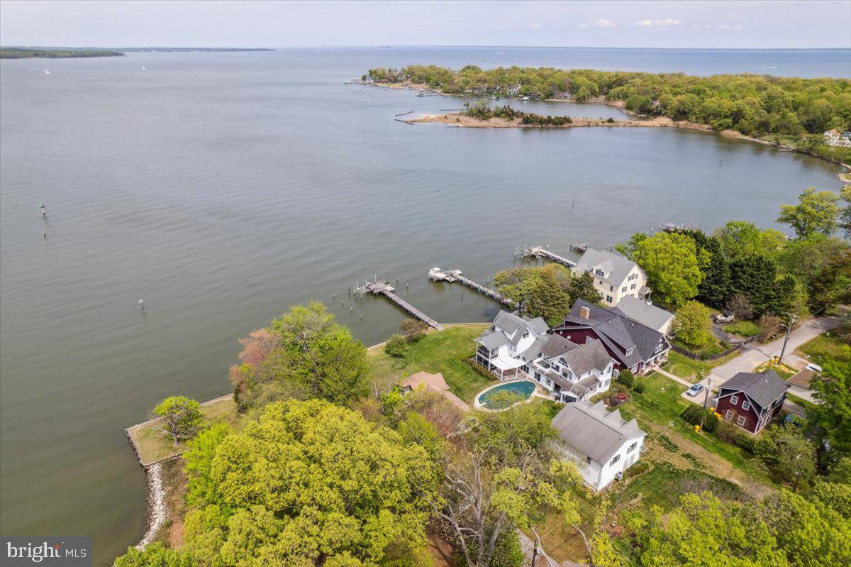 4801 Avery Road Shady Side, MD 20764 - Photo 4 of 25 a view of a lake with a mountain in the background