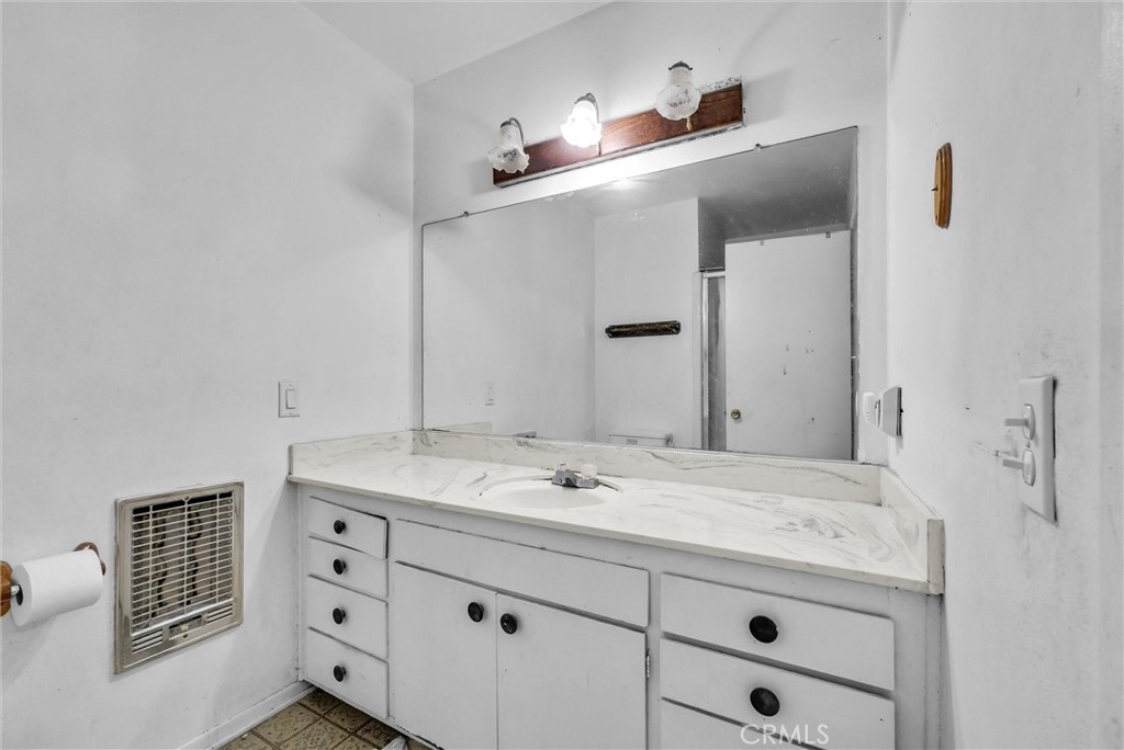6254 Stanton Avenue Highland, CA 92346 - Photo 17 of 29 a bathroom with a sink and a mirror