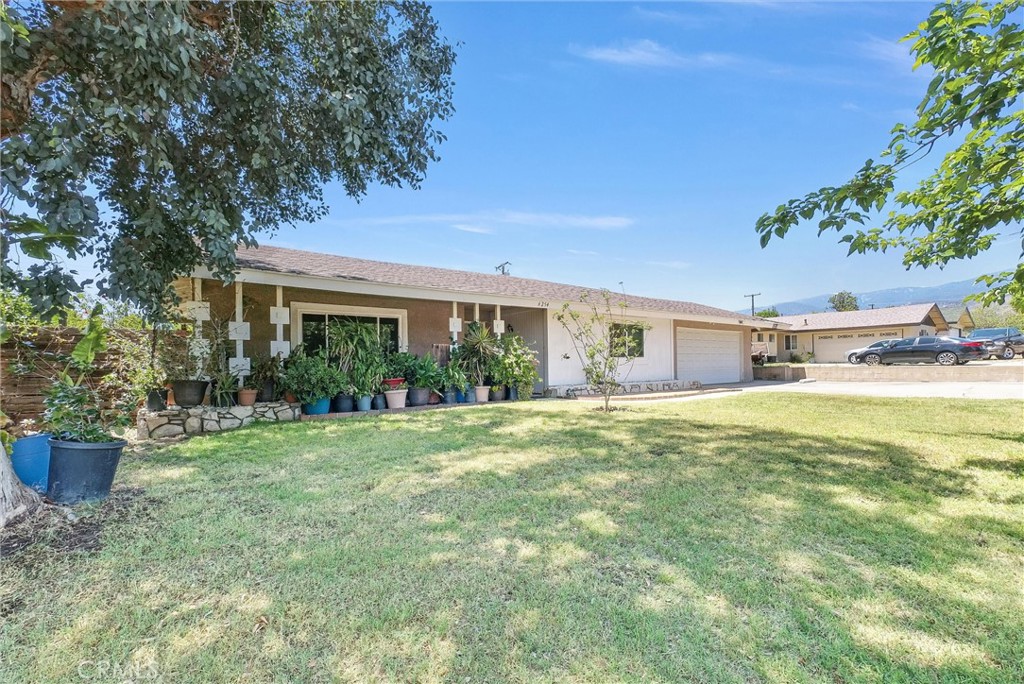 6254 Stanton Avenue Highland, CA 92346 - Photo 3 of 29 a house view with a garden space