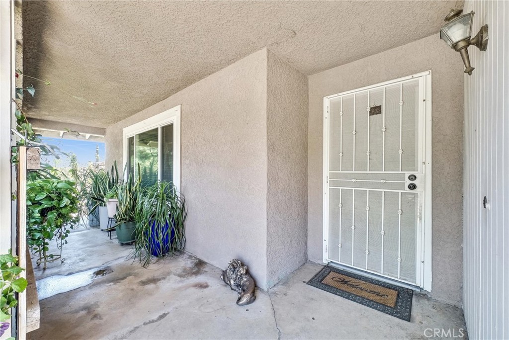 6254 Stanton Avenue Highland, CA 92346 - Photo 4 of 29 a view of a house with a backyard space and windows