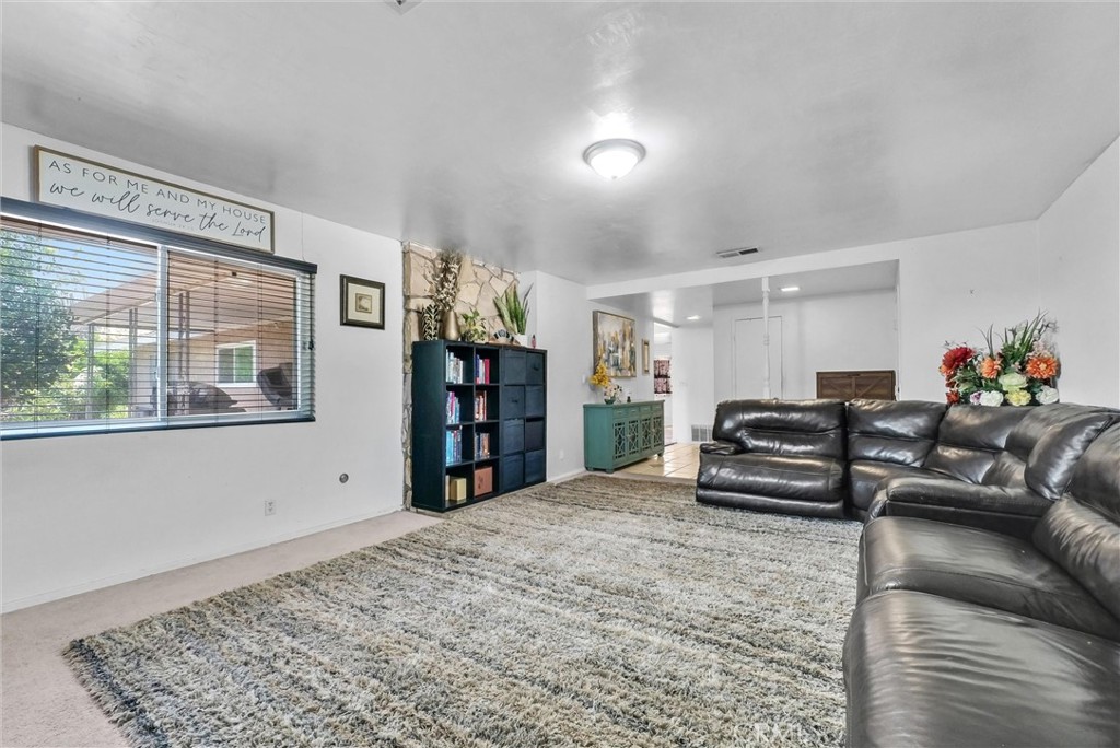 6254 Stanton Avenue Highland, CA 92346 - Photo 7 of 29 a living room with furniture window and wooden floor