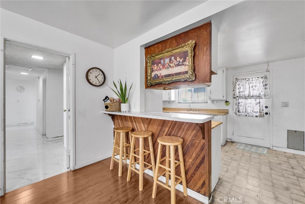 6254 Stanton Avenue Highland, CA 92346 - Photo 9 of 29 a kitchen with stainless steel appliances granite countertop a sink and a stove top oven